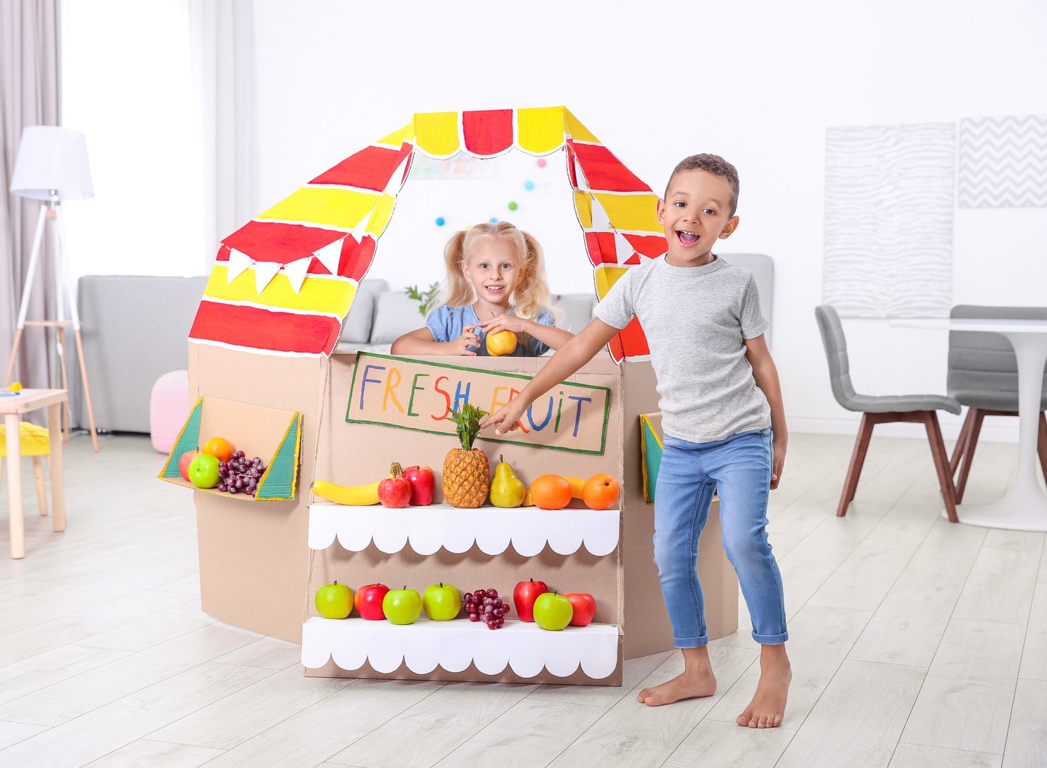 Little Girl Pretend-Playing to Sell Fruits