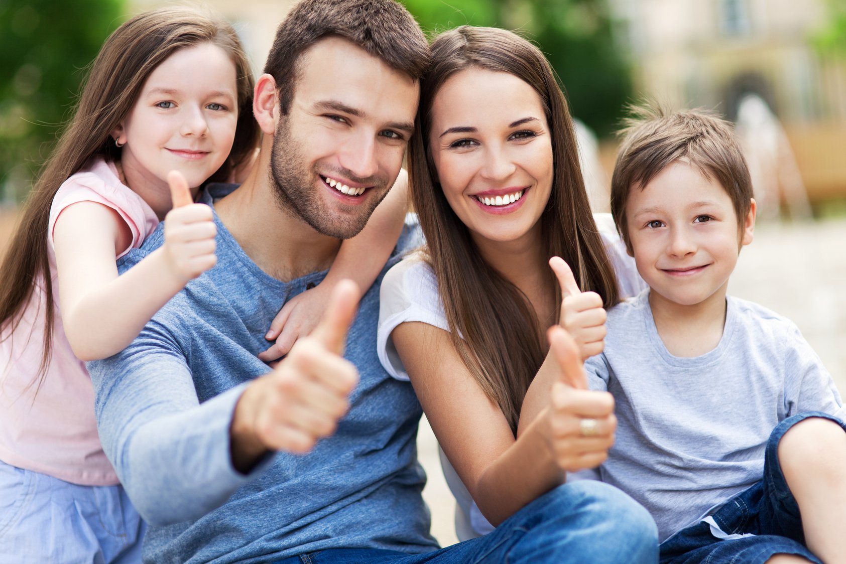 Family showing thumbs up